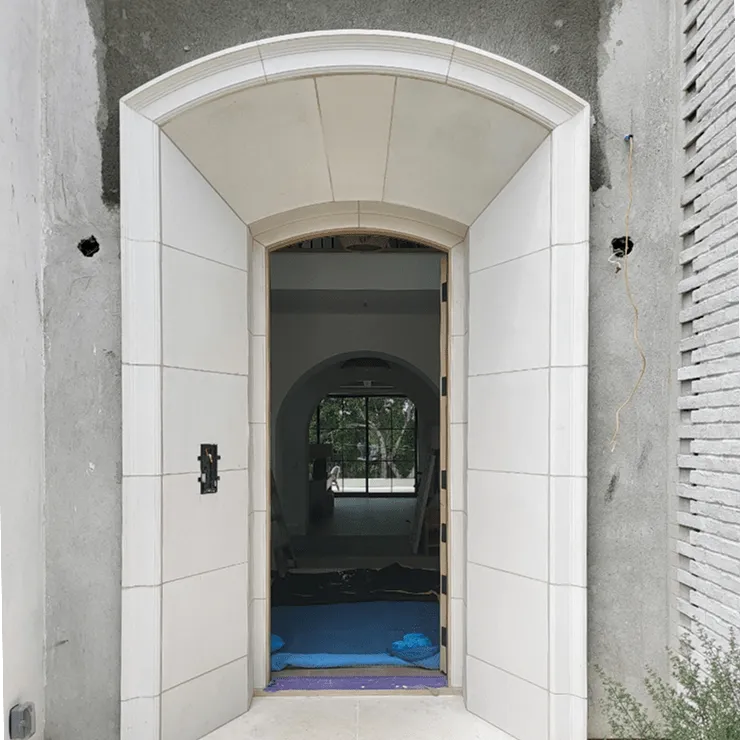 Stone-tiled arched entryway under construction